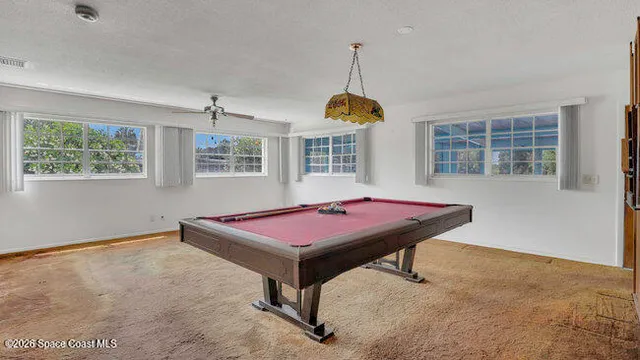 a spacious bedroom with a bed and furniture