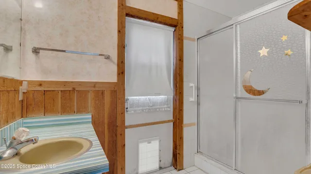 an aerial view of residential houses with outdoor space and lake view