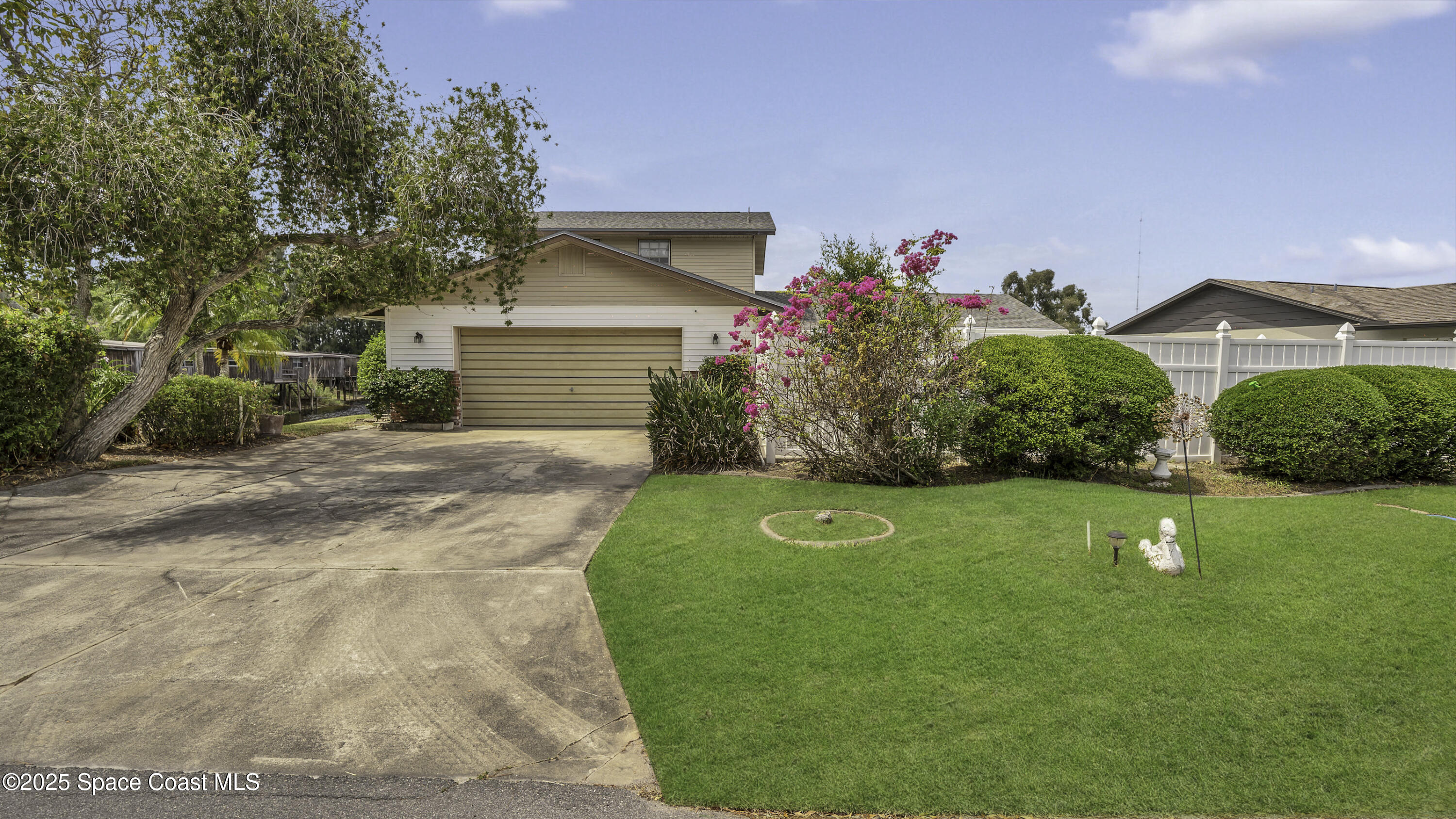 850 Cardinal Road Cocoa, FL 32926 - Photo 29 of 41 a front view of a house with a yard and garage