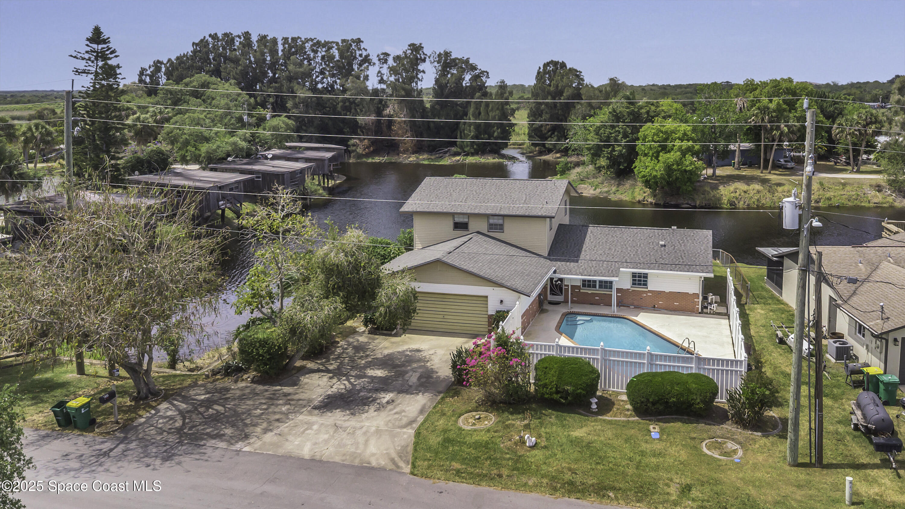 850 Cardinal Road Cocoa, FL 32926 - Photo 35 of 41 an aerial view of a house with a yard and lake view