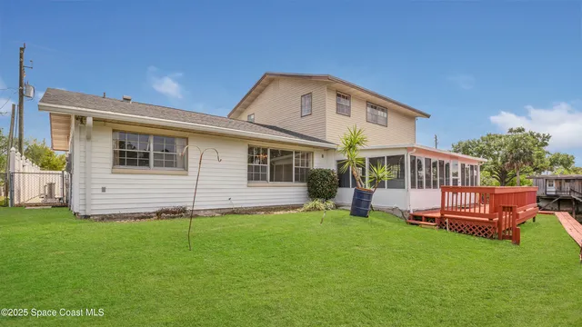 a kitchen with a sink stainless steel appliances and white cabinets