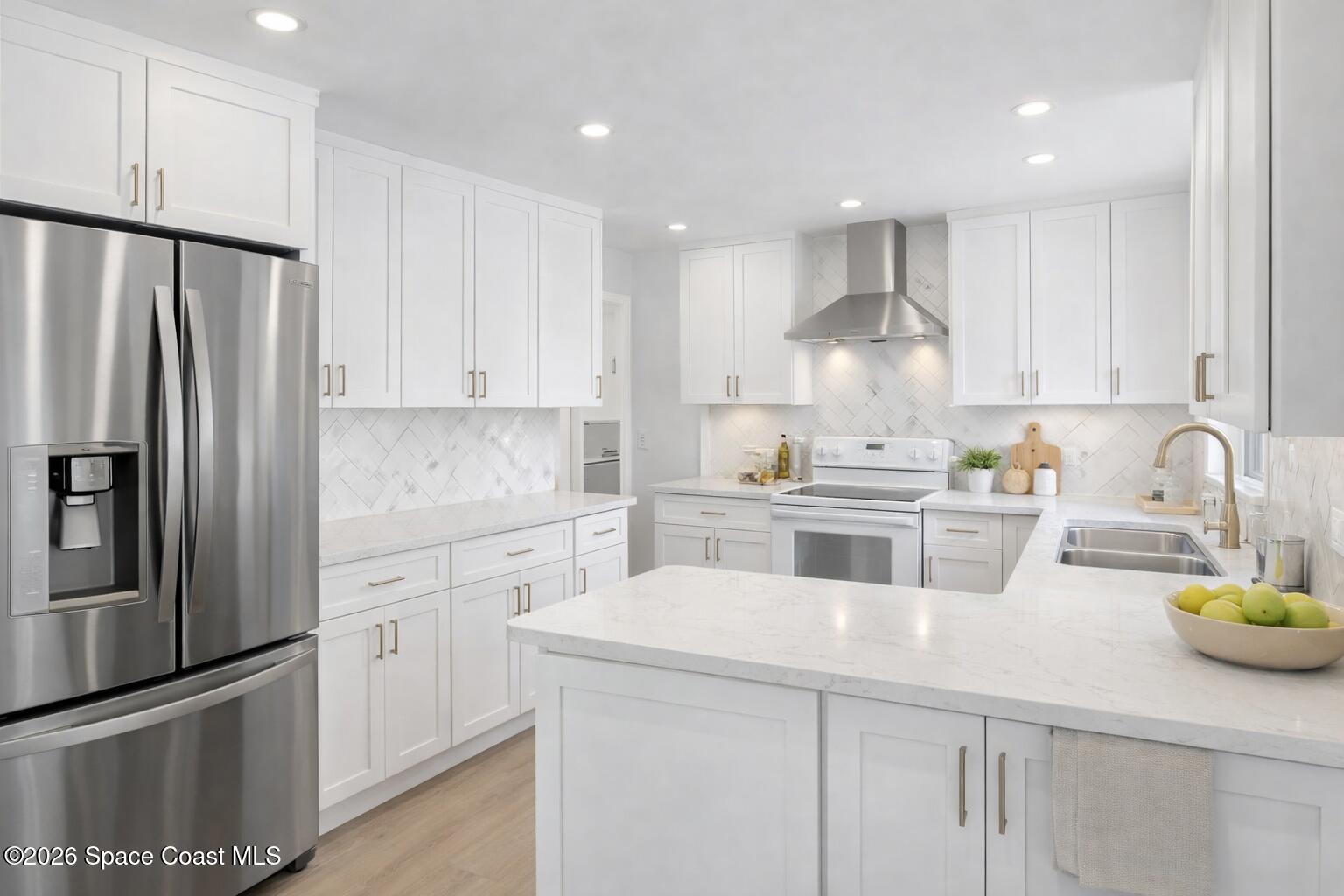 850 Cardinal Road Cocoa, FL 32926 - Photo 7 of 41 a kitchen with a sink stainless steel appliances and white cabinets
