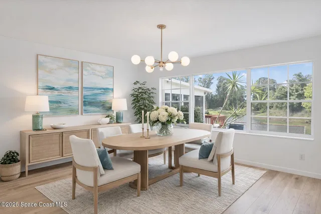 a room with pool table and windows