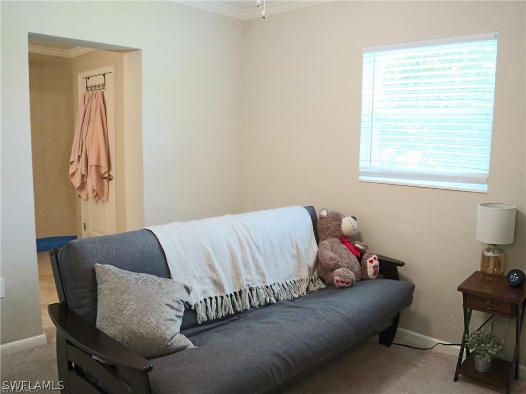 1453 Mandel Road Fort Myers, FL 33919 - Photo 12 of 16 a bed sitting in a bedroom next to a window