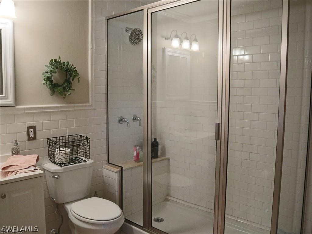 1453 Mandel Road Fort Myers, FL 33919 - Photo 14 of 16 a bathroom with a toilet and a shower