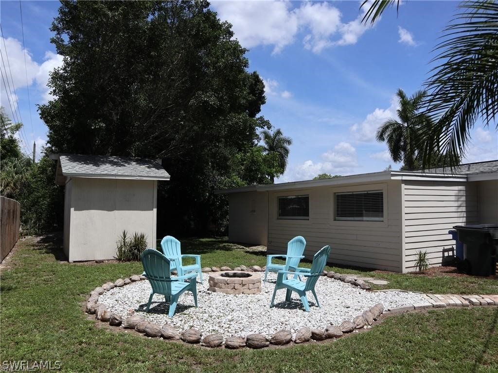 1453 Mandel Road Fort Myers, FL 33919 - Photo 15 of 16 a backyard of house with yard barbeque oven and outdoor seating