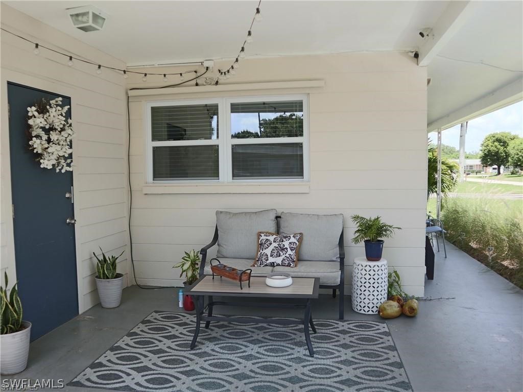 1453 Mandel Road Fort Myers, FL 33919 - Photo 3 of 16 a living room with furniture and a potted plant