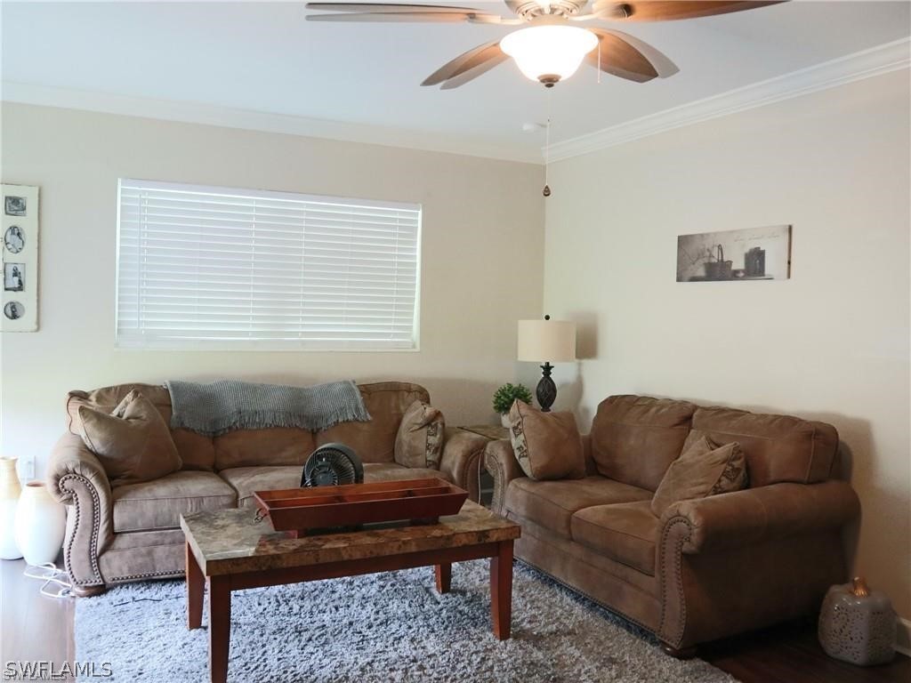 1453 Mandel Road Fort Myers, FL 33919 - Photo 4 of 16 a living room with furniture and a large window