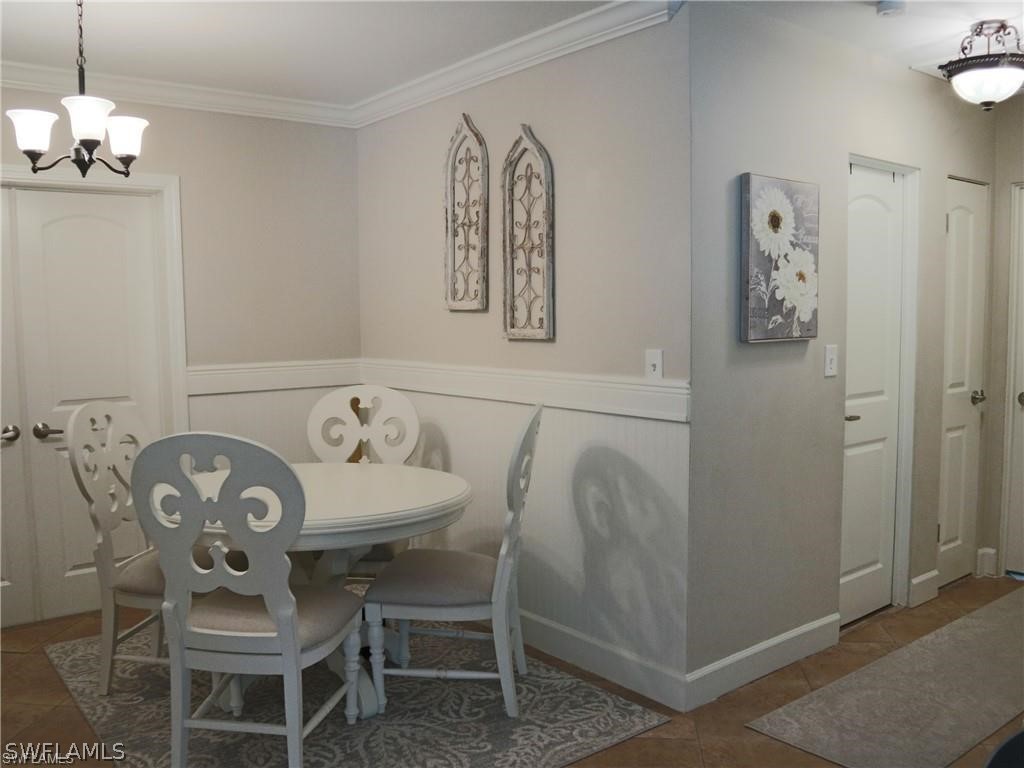 1453 Mandel Road Fort Myers, FL 33919 - Photo 7 of 16 a view of a dining room with furniture and wooden floor