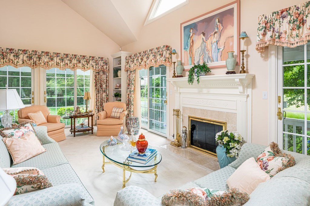 11 Forest Lane, Unit 11 Scituate, MA 02066 - Photo 16 of 39 a living room with furniture and a fireplace