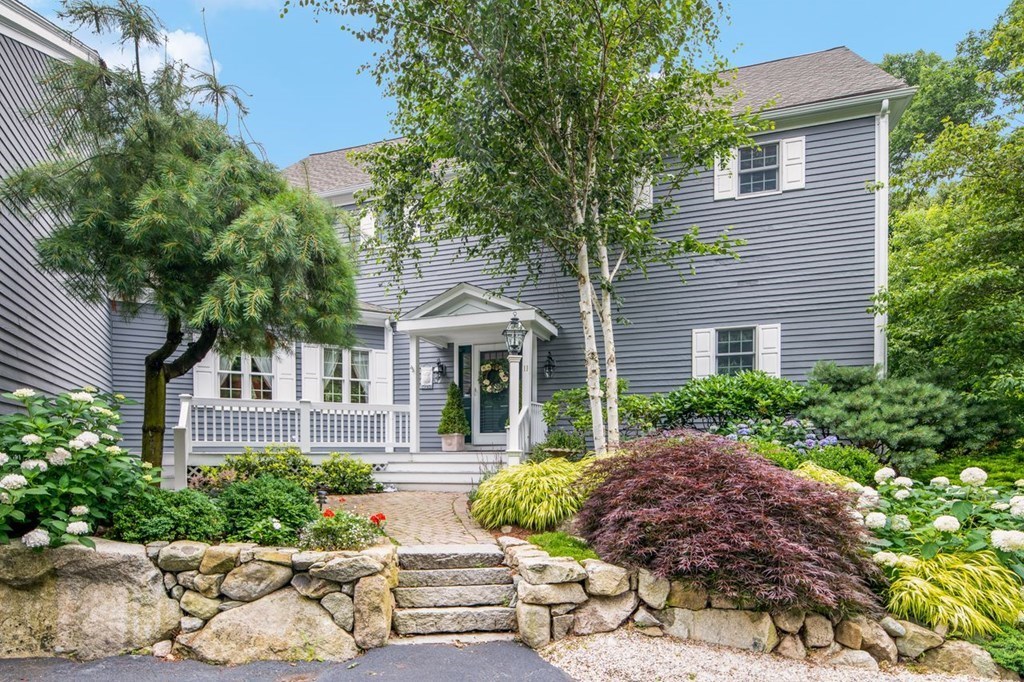 11 Forest Lane, Unit 11 Scituate, MA 02066 - Photo 2 of 39 a front view of a house with garden