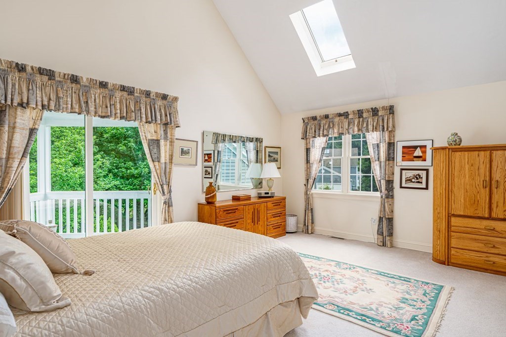 11 Forest Lane, Unit 11 Scituate, MA 02066 - Photo 24 of 39 a bedroom with a large bed couch and a window