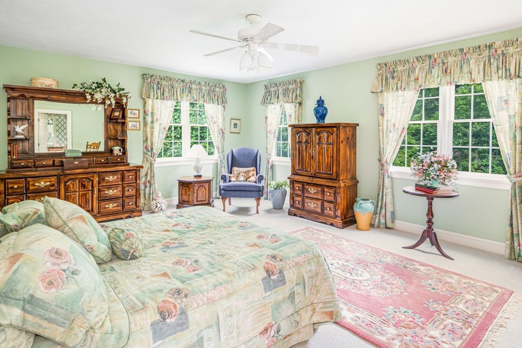 11 Forest Lane, Unit 11 Scituate, MA 02066 - Photo 28 of 39 a bed room with a bed dresser and a couch