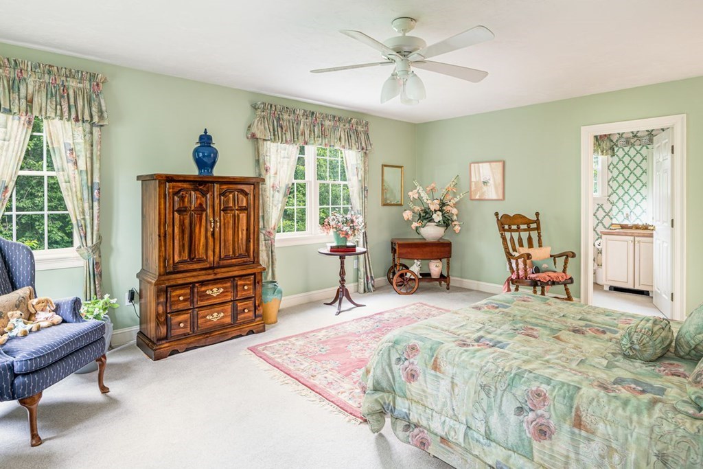 11 Forest Lane, Unit 11 Scituate, MA 02066 - Photo 29 of 39 a bed room with a bed and a chair