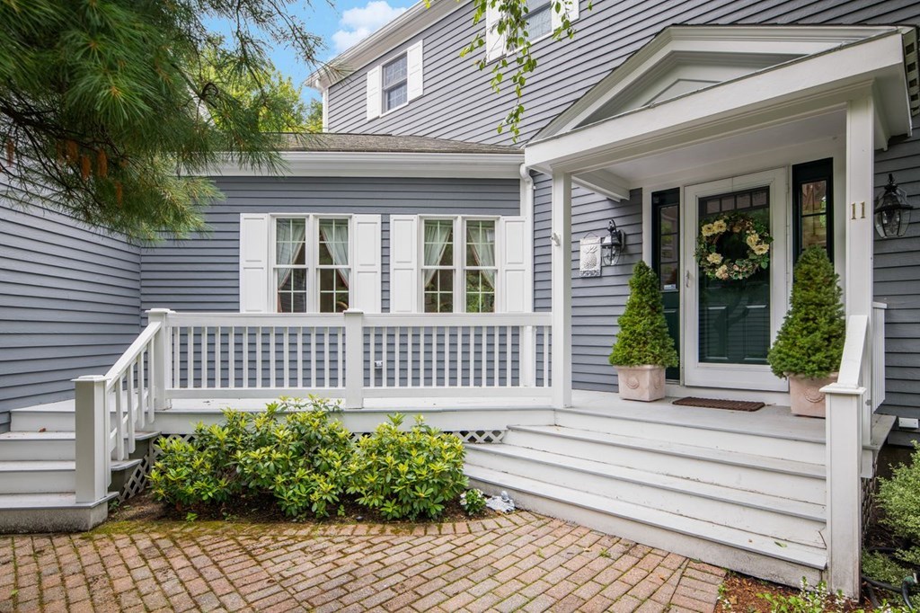 11 Forest Lane, Unit 11 Scituate, MA 02066 - Photo 39 of 39 a view of a house with a small deck and furniture