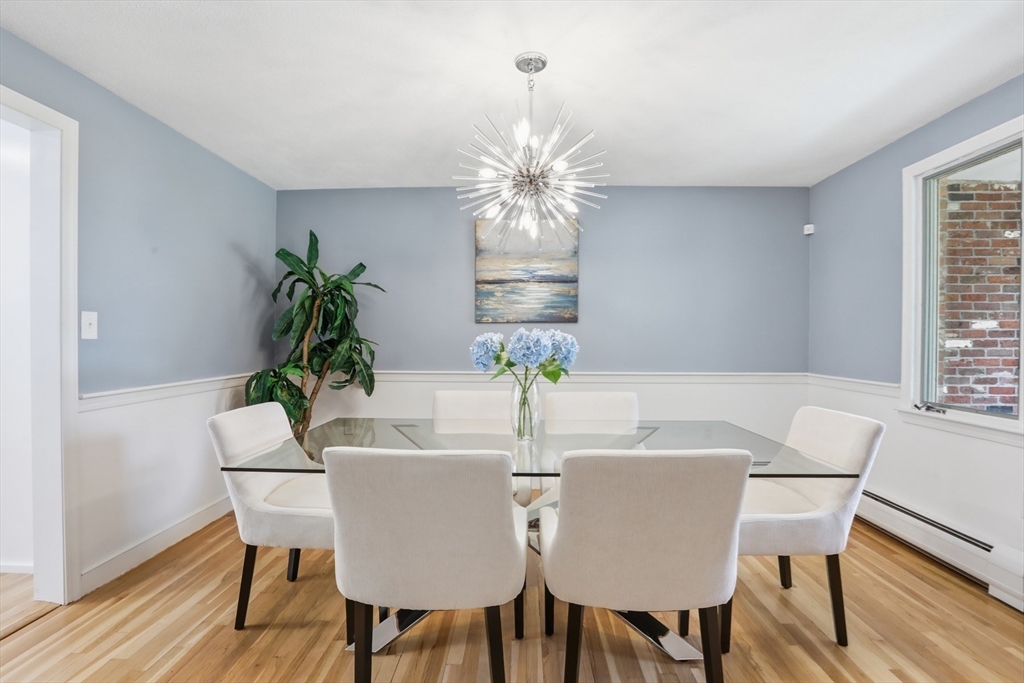 94 Johnson Road Winchester, MA 01890 - Photo 10 of 40 a view of a dining room with furniture window and wooden floor