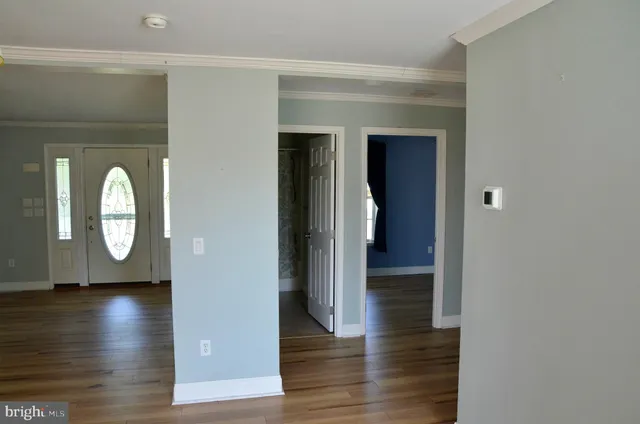 a bathroom with a granite countertop toilet a sink and a shower