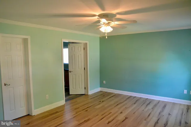 a bathroom with mirror sink and window