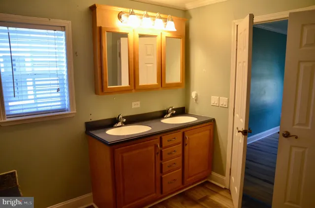 a room that has a window in it and a sink