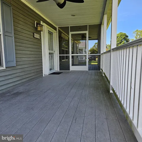 a view of a porch with wooden floor