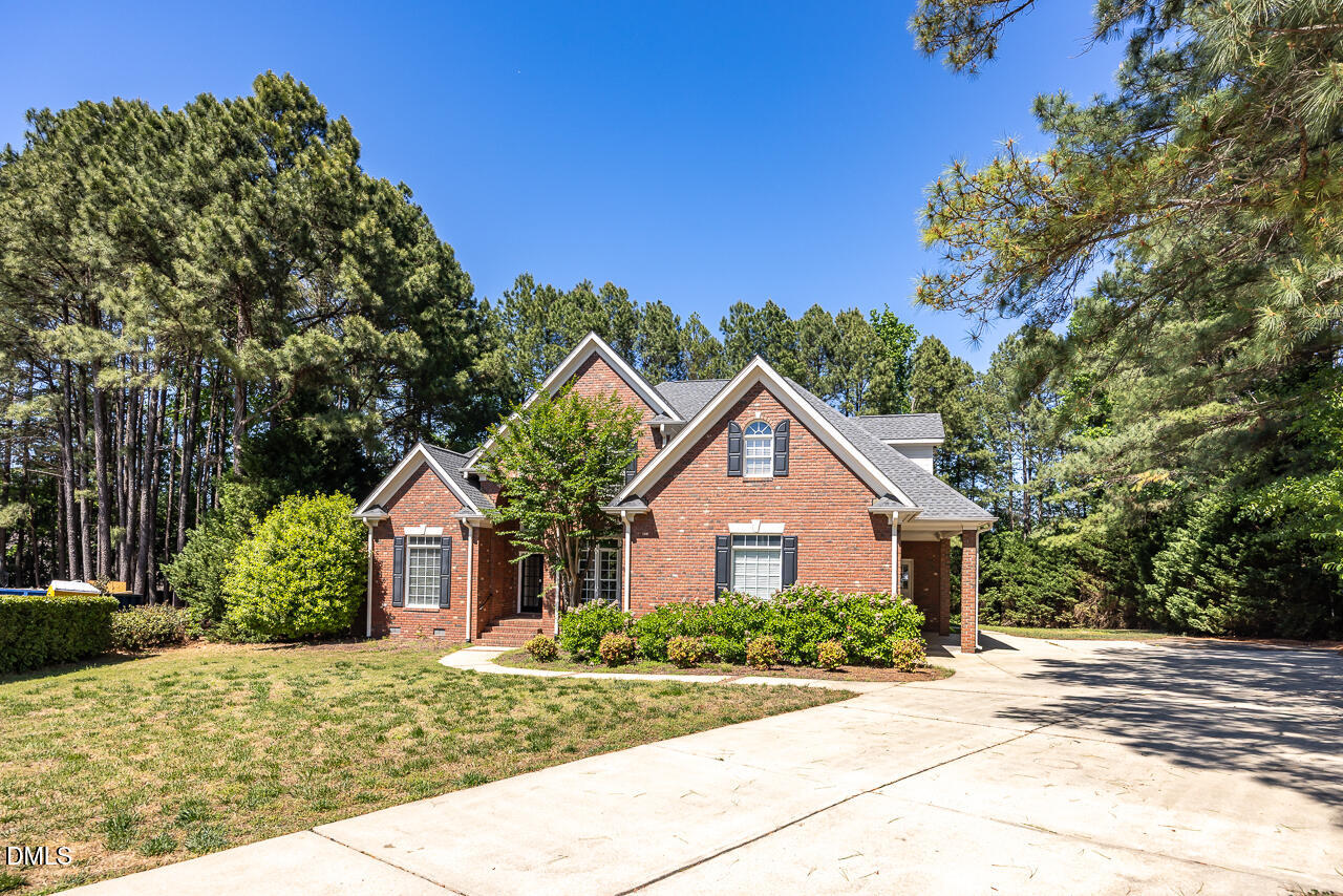 4004 Frontenac Court Apex, NC 27539 - Photo 61 of 61 a front view of a house with garden