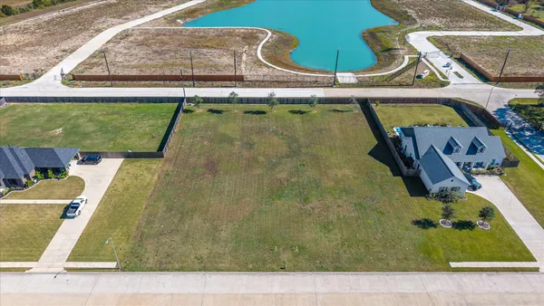 view of a pool with a yard