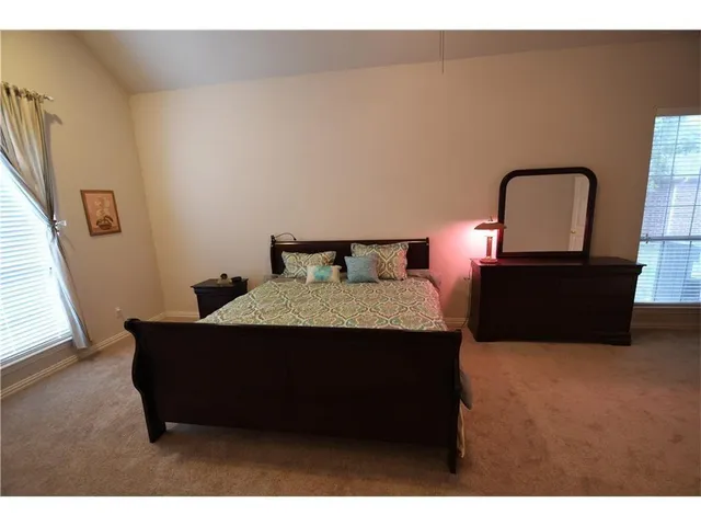 a room with furniture and a mirror