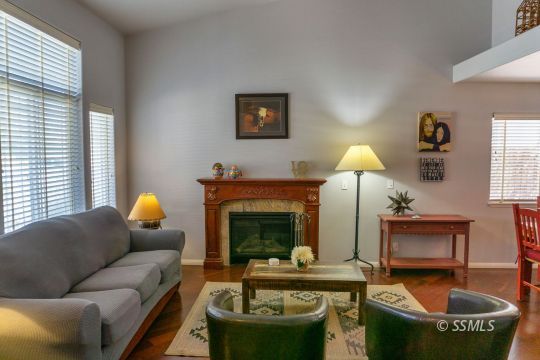 718 La Paloma Street Ridgecrest, CA 93555 - Photo 8 of 50 a living room with furniture and a fireplace
