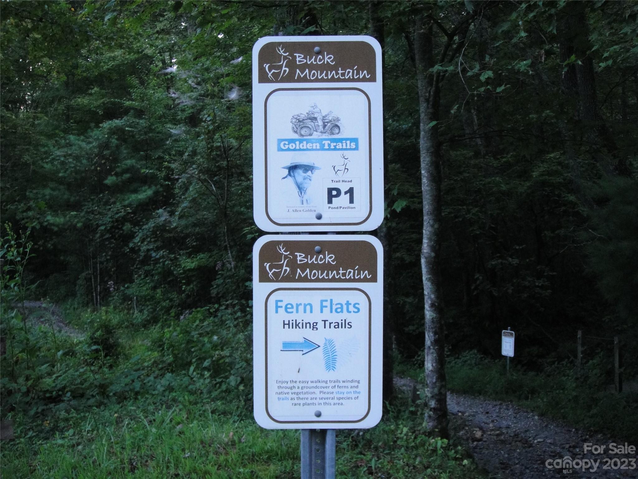 Tbd Deer Antler Road, Unit 84 Purlear, NC 28665 - Photo 20 of 36 a sign on the side of the road