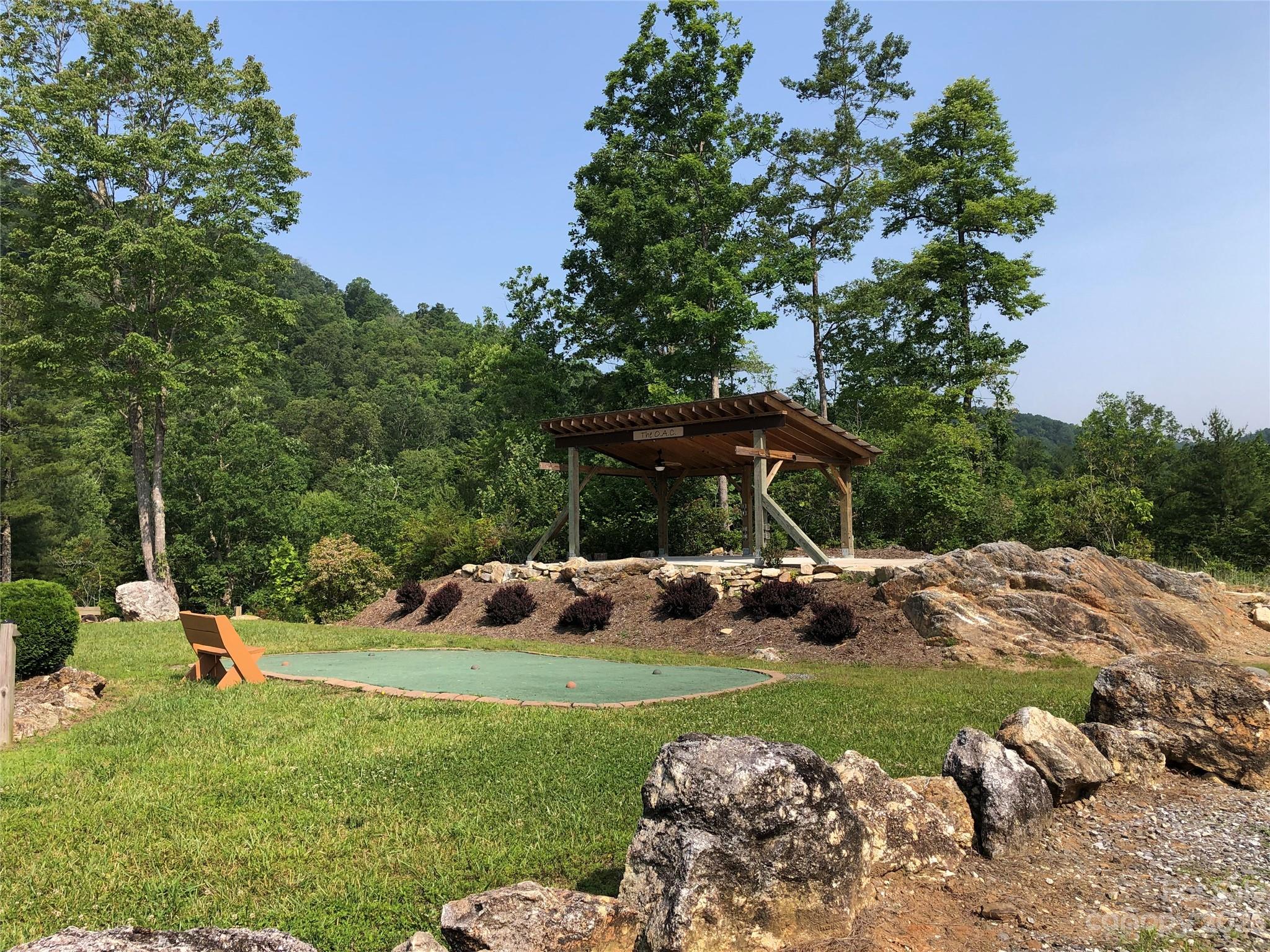 Tbd Deer Antler Road, Unit 84 Purlear, NC 28665 - Photo 35 of 36 a view of a backyard with a garden and plants