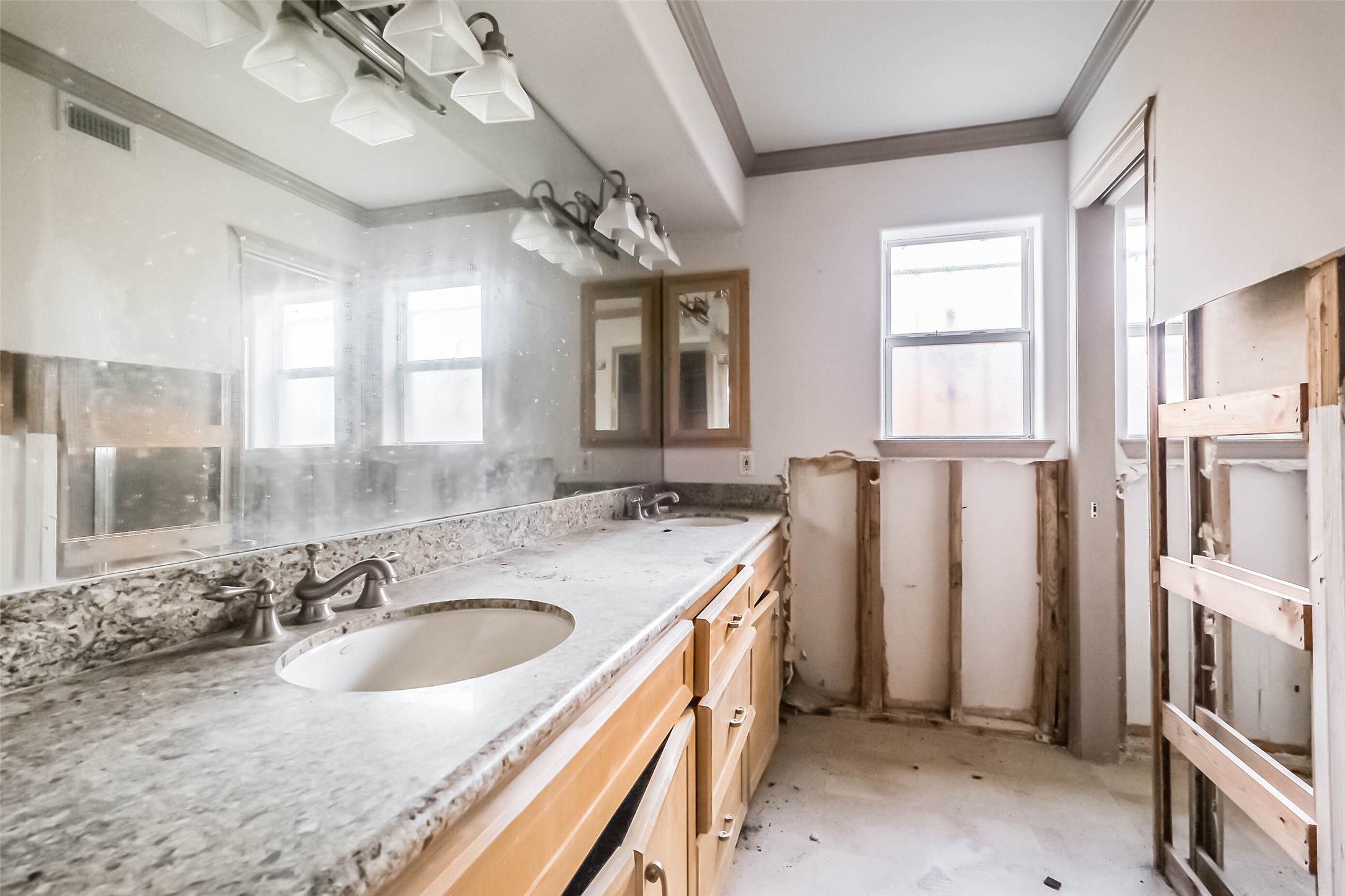 5218 Contour Place Houston, TX 77096 - Photo 12 of 22 a bathroom with a sink double vanity granite tub and shower