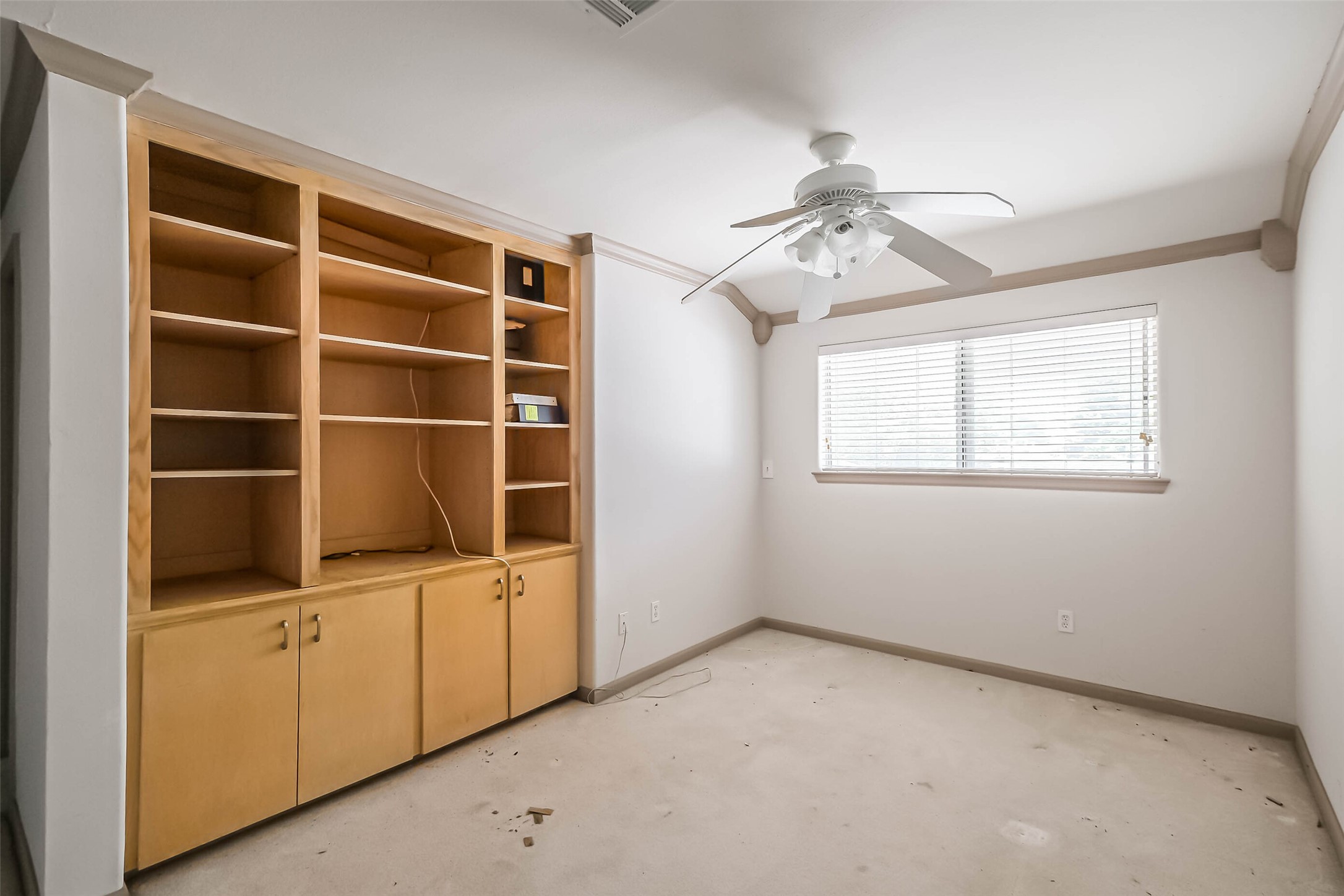 5218 Contour Place Houston, TX 77096 - Photo 15 of 22 a view of an empty room with a window and a kitchen