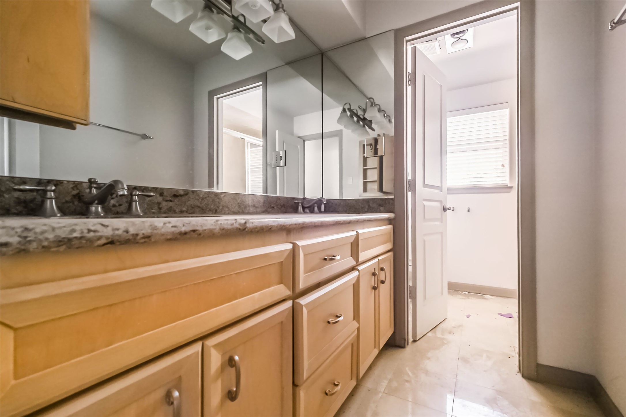 5218 Contour Place Houston, TX 77096 - Photo 17 of 22 a bathroom with a sink a vanity and a mirror