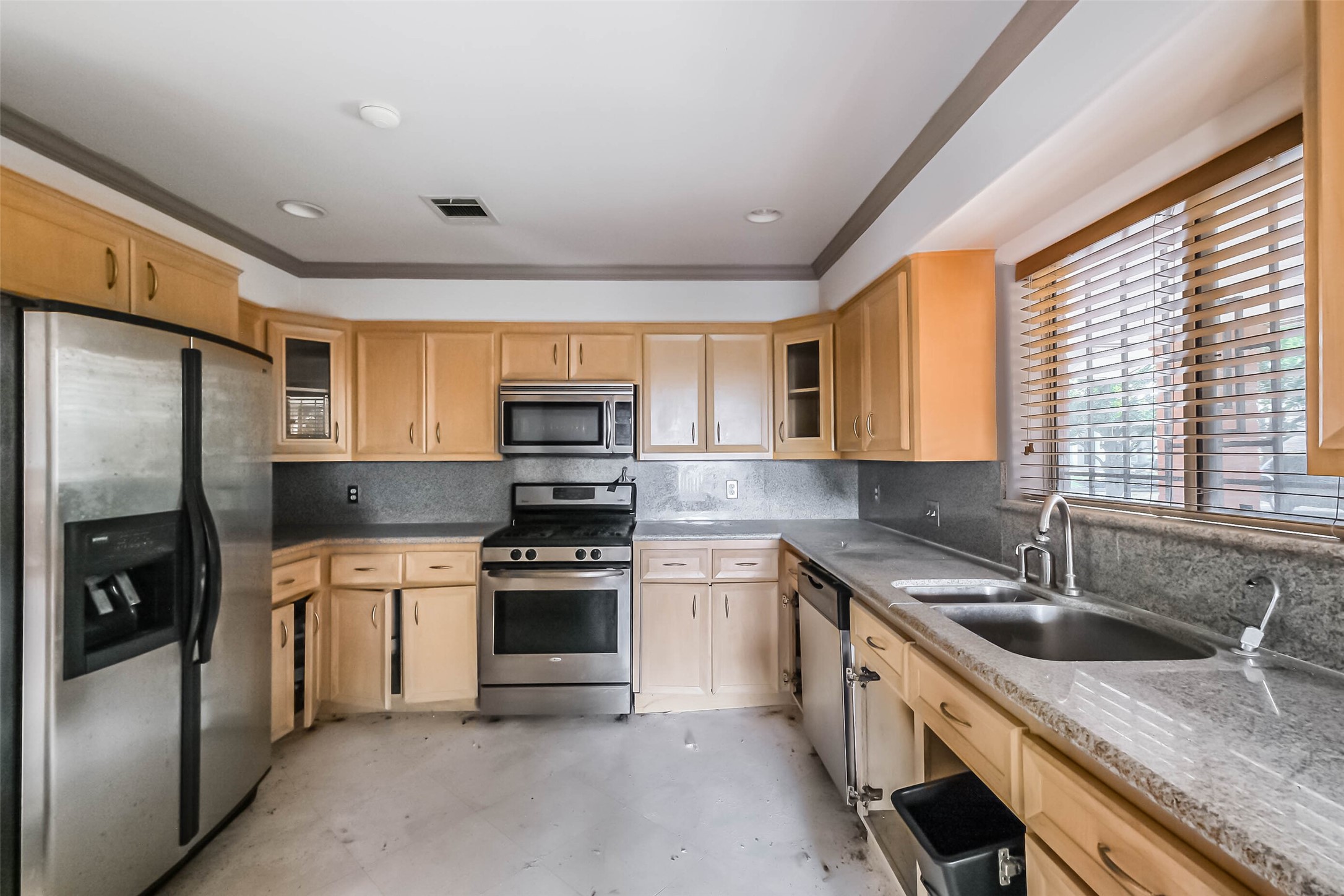 5218 Contour Place Houston, TX 77096 - Photo 8 of 22 a kitchen with stainless steel appliances granite countertop a sink stove and refrigerator