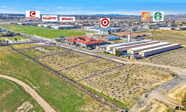 a view of swimming pool with a table & chairs
