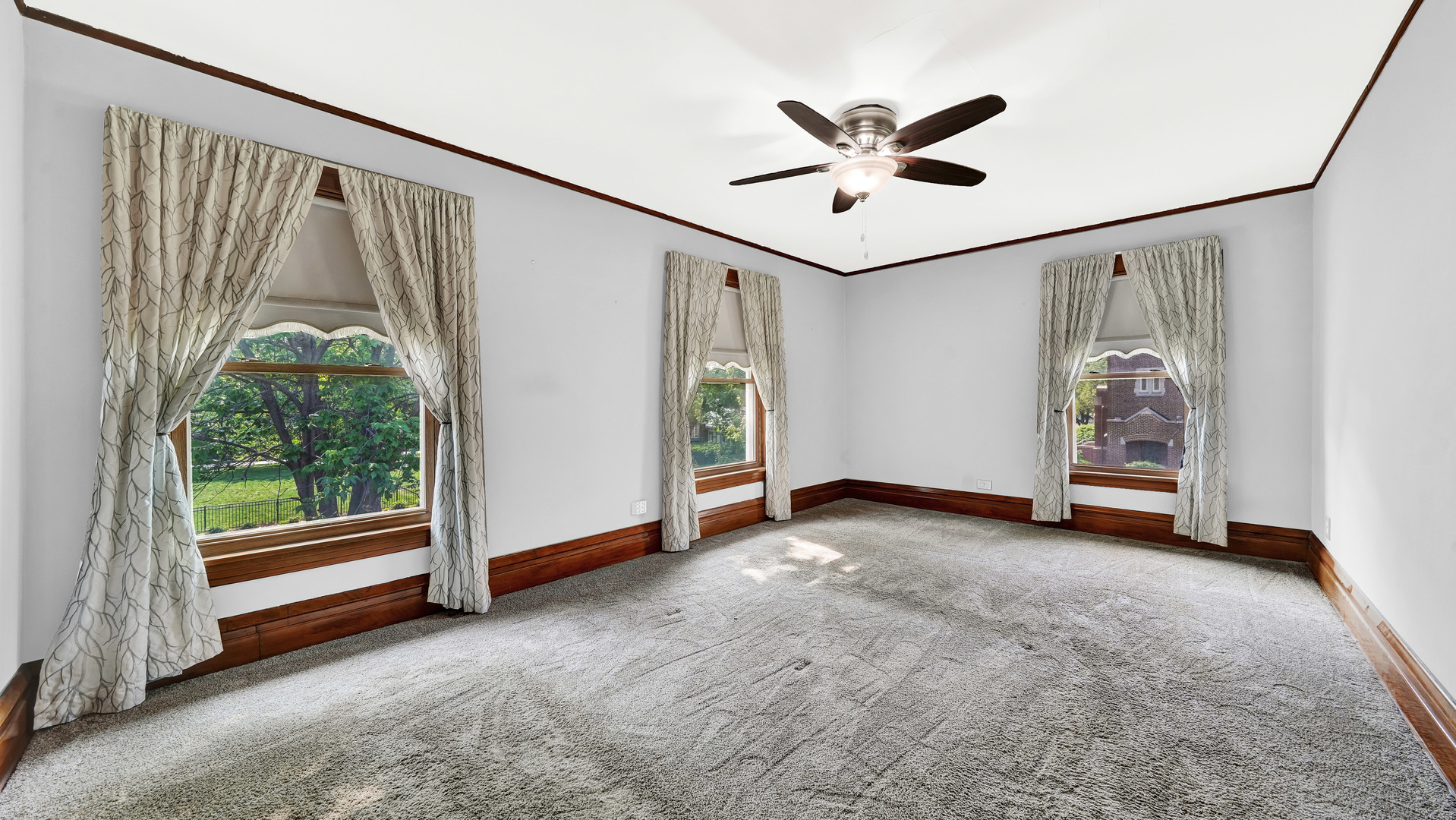 3130 Clinton Avenue Berwyn, IL 60402 - Photo 18 of 30 a view of room with window and ceiling fan