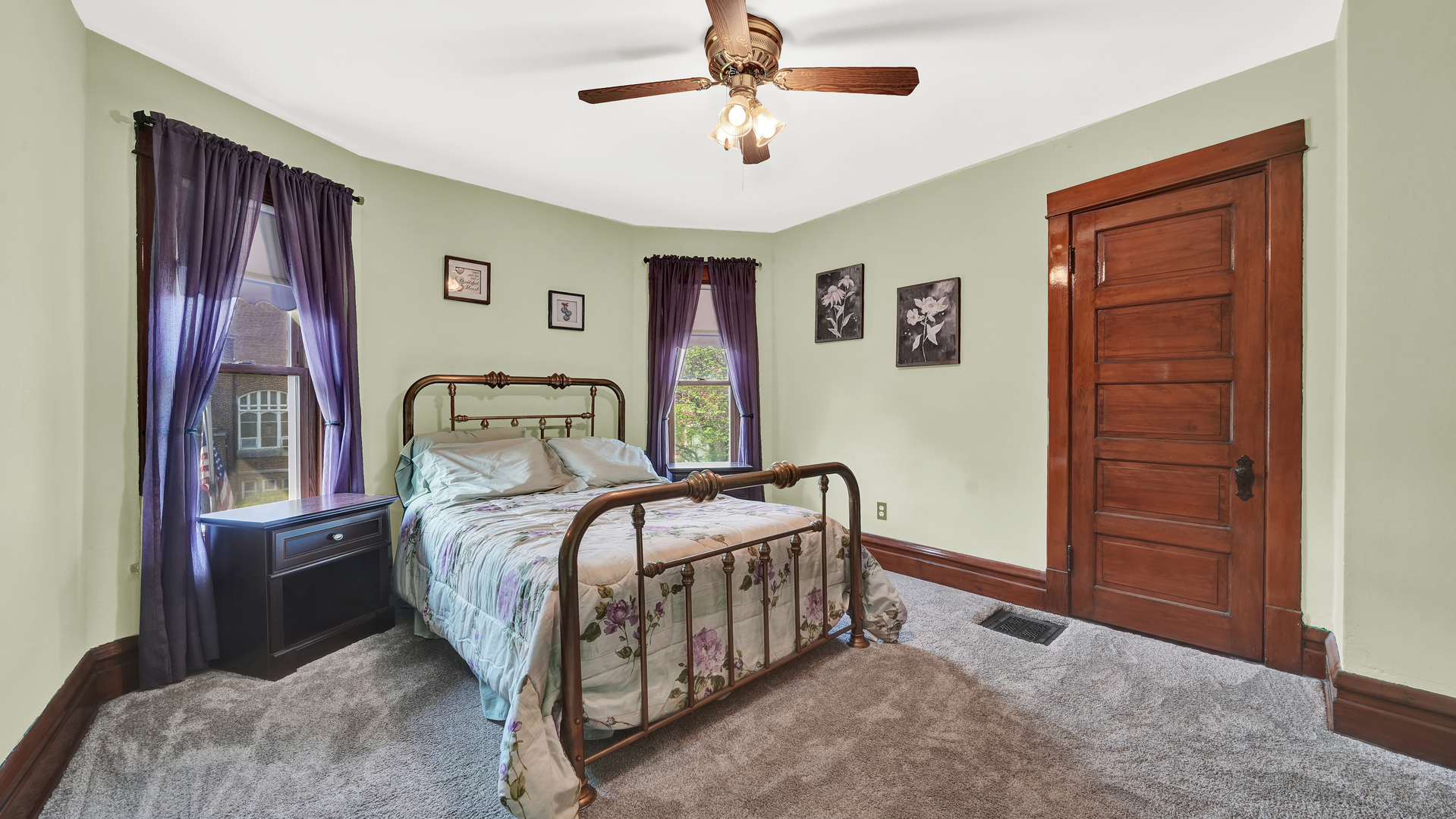 3130 Clinton Avenue Berwyn, IL 60402 - Photo 20 of 30 a bedroom with a bed and a chandelier