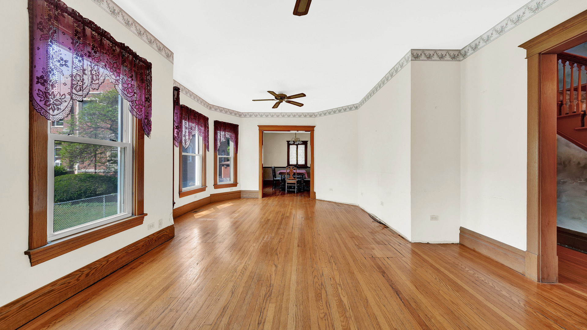 3130 Clinton Avenue Berwyn, IL 60402 - Photo 6 of 30 a view of a hallway with wooden floor and furniture