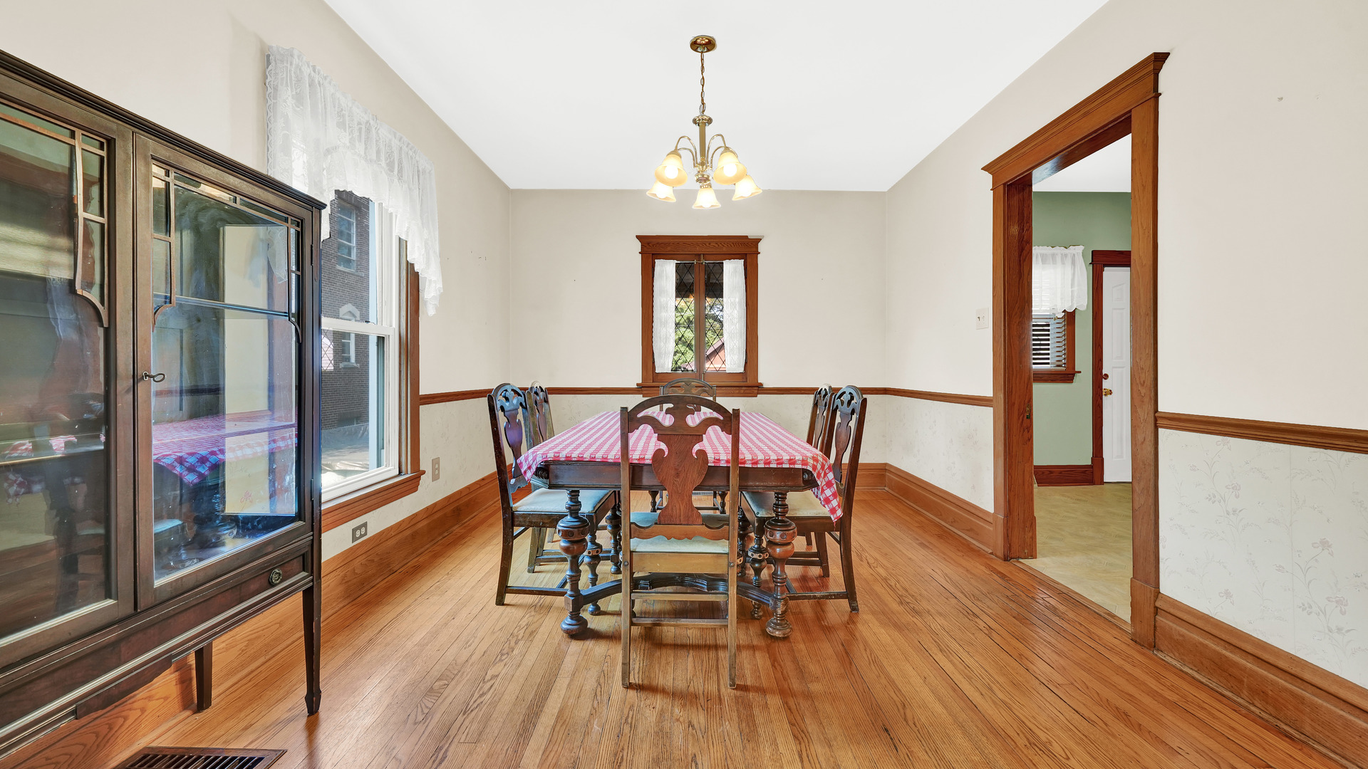 3130 Clinton Avenue Berwyn, IL 60402 - Photo 8 of 30 a view of a dining room with furniture window and wooden floor
