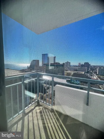 a view of kitchen with furniture and refrigerator