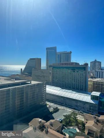 a large bed sitting in a bedroom next to a cabinet