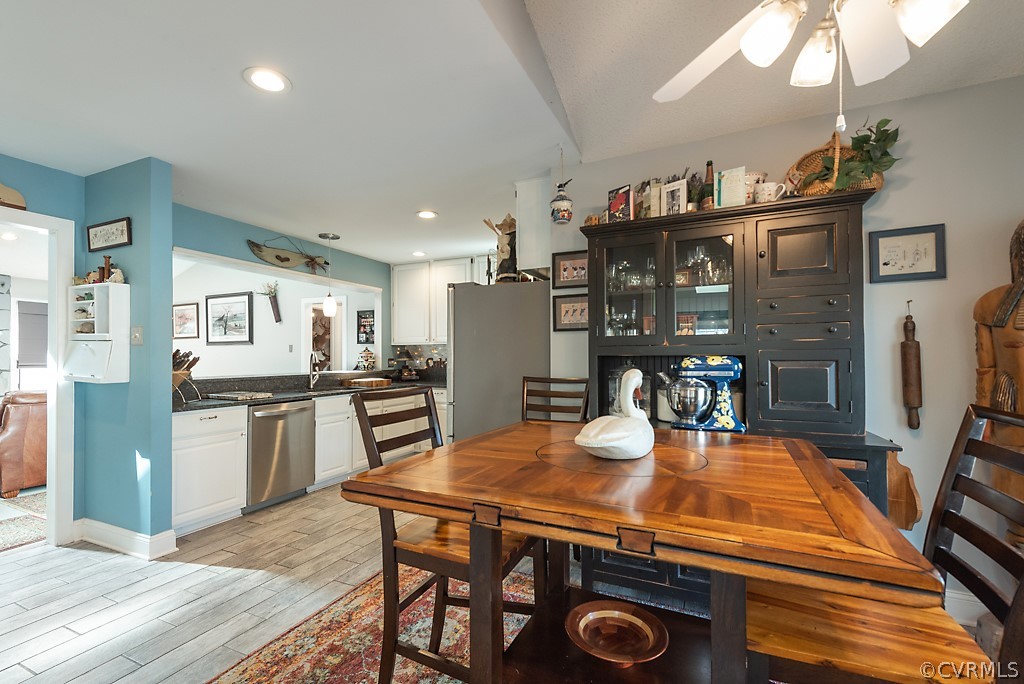 4708 Twin Cedars Road Chester, VA 23831 - Photo 13 of 38 a kitchen with a table chairs refrigerator and microwave