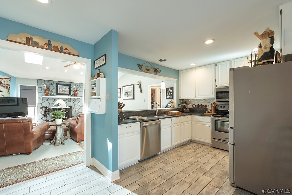 4708 Twin Cedars Road Chester, VA 23831 - Photo 14 of 38 a kitchen with stainless steel appliances granite countertop a refrigerator and a stove top oven