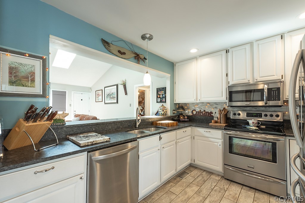 4708 Twin Cedars Road Chester, VA 23831 - Photo 15 of 38 a kitchen with a sink stove and microwave