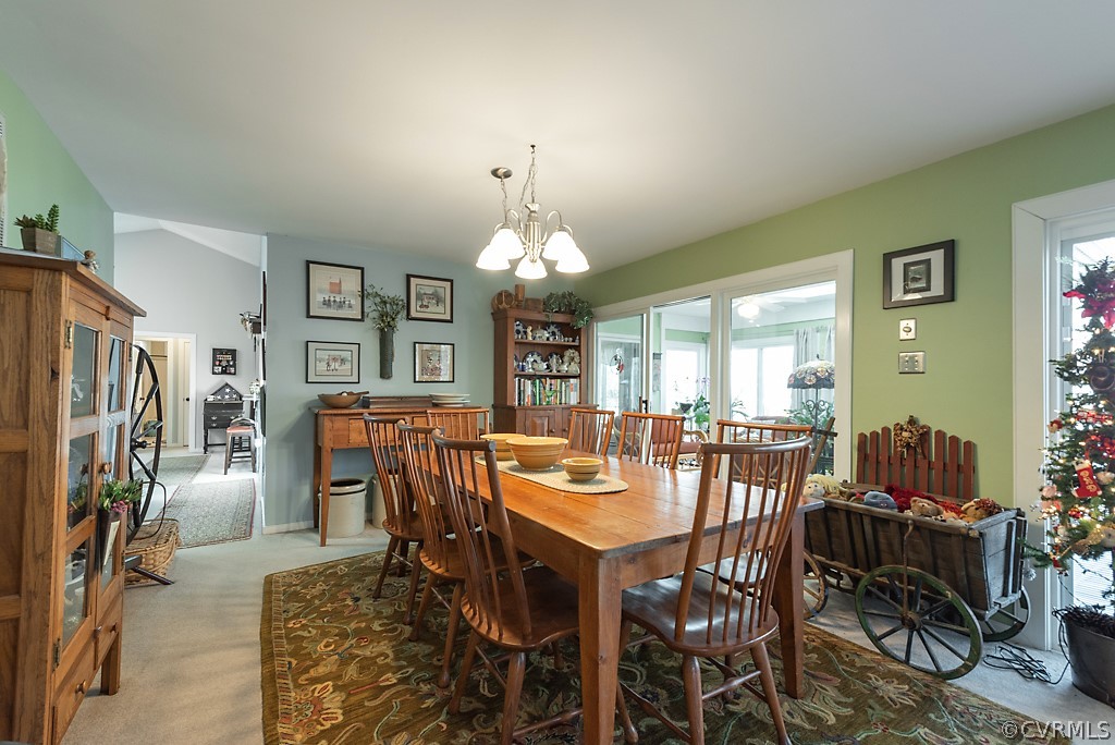 4708 Twin Cedars Road Chester, VA 23831 - Photo 16 of 38 a view of a dining room with furniture and chandelier