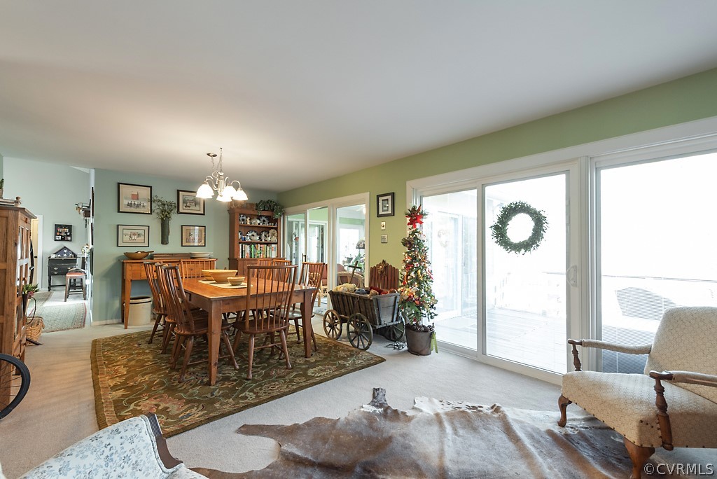4708 Twin Cedars Road Chester, VA 23831 - Photo 18 of 38 a view of a dining room with furniture window and wooden floor