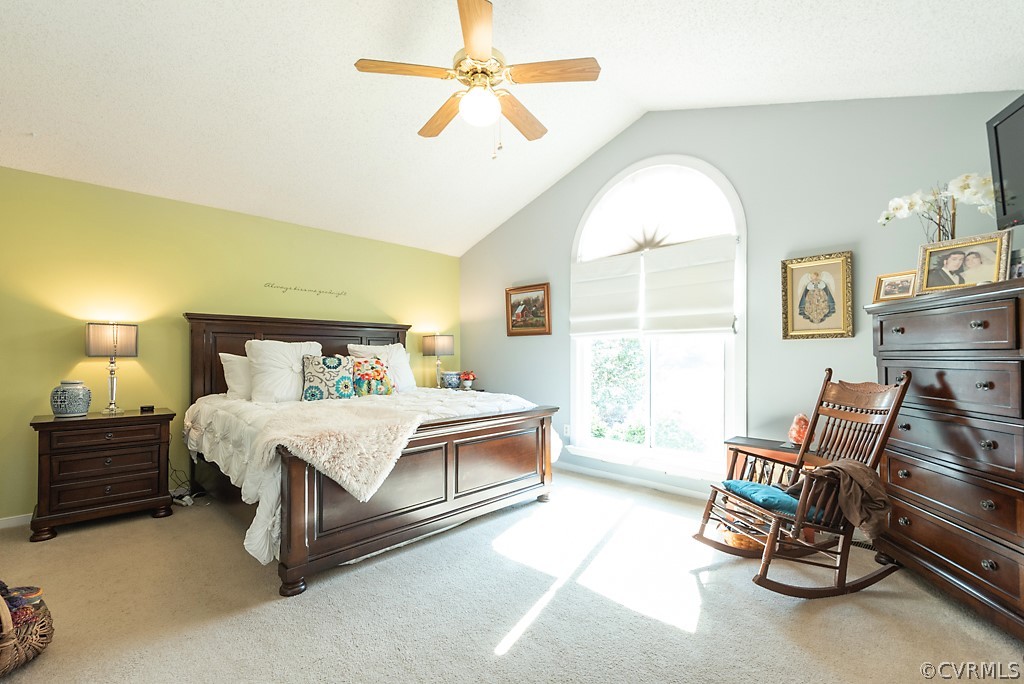 4708 Twin Cedars Road Chester, VA 23831 - Photo 20 of 38 a bedroom with a bed a chair and a chandelier