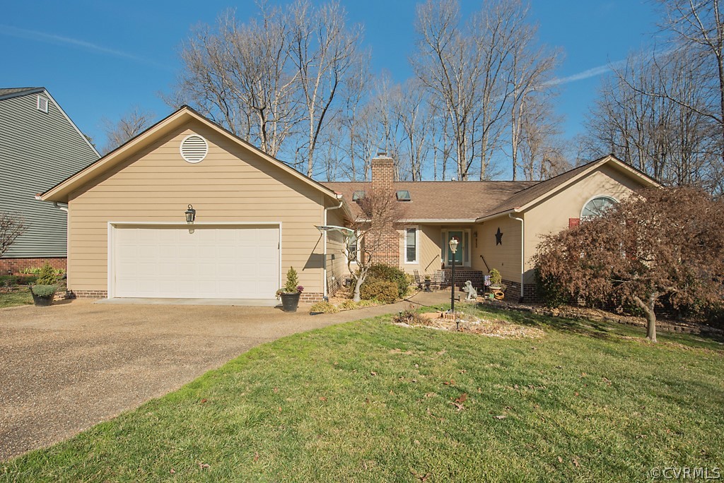 4708 Twin Cedars Road Chester, VA 23831 - Photo 2 of 38 a backyard of a house with table and chairs