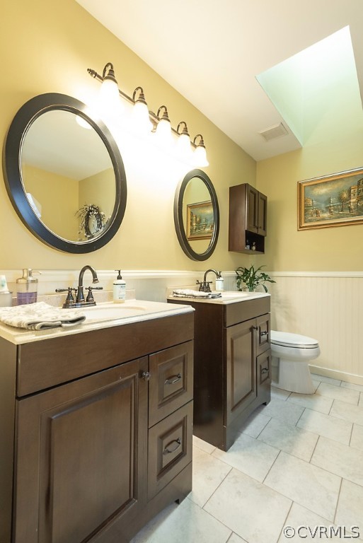4708 Twin Cedars Road Chester, VA 23831 - Photo 23 of 38 a bathroom with a granite countertop toilet sink and mirror