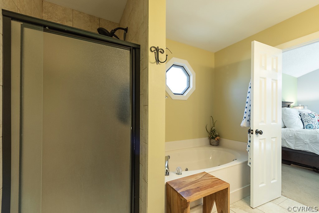 4708 Twin Cedars Road Chester, VA 23831 - Photo 24 of 38 a bathroom with a bathtub and a sink